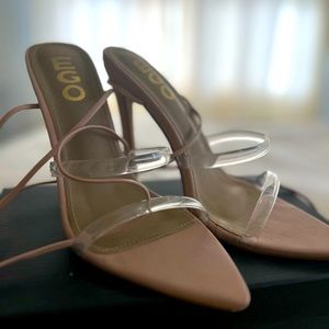 Blush pointed heel. Clear straps across foot. Wrap around leg.